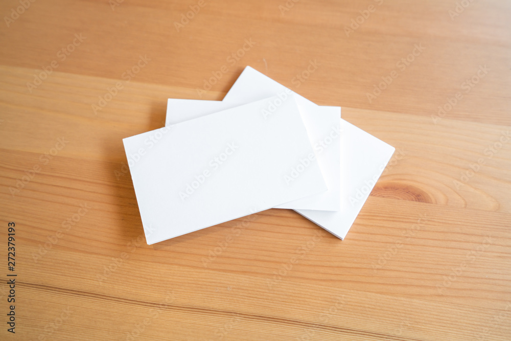 Blank business cards on wooden surface Blank business cards on wooden surface