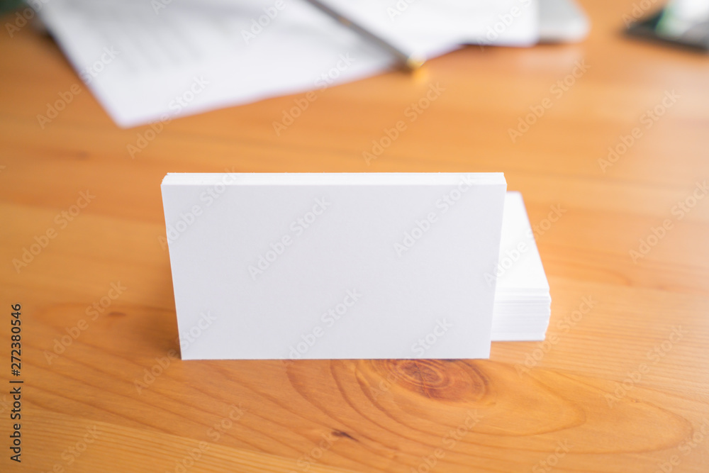 Blank business cards on wooden surface Blank business cards on wooden surface