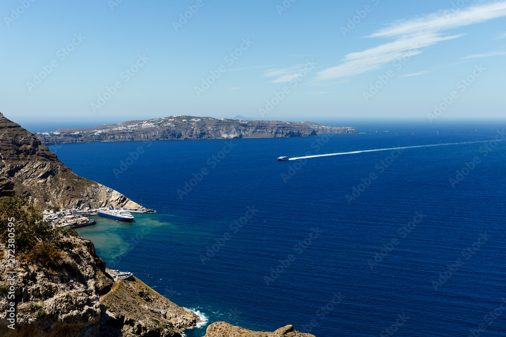 Picturesque view of the city of Santorini. White buildings, sea, mountains. Romantic vacation by the sea