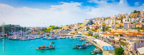 Panoramic view of Mikrolimano with colorful houses along the marina in Piraeus, Greece.