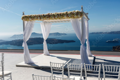 Beautifully arranged place for a wedding ceremony on the Greek coast. Romantic vacation by the sea © nazariykarkhut