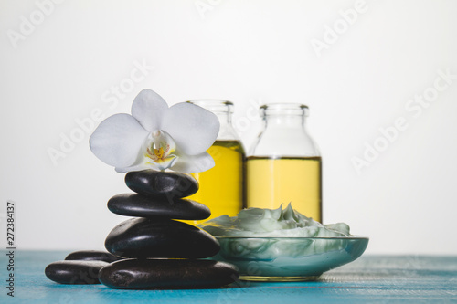 Spa theme with volcanic stones, orchid and oil