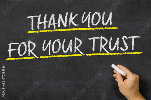 Thank you for your trust written on a blackboard