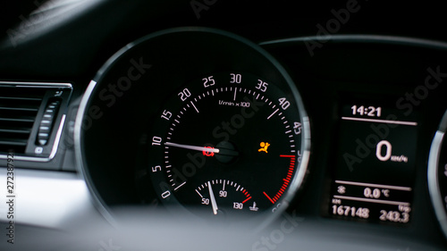 Modern car dashboard. Tachometer, fuel level and icons on the panel screen.