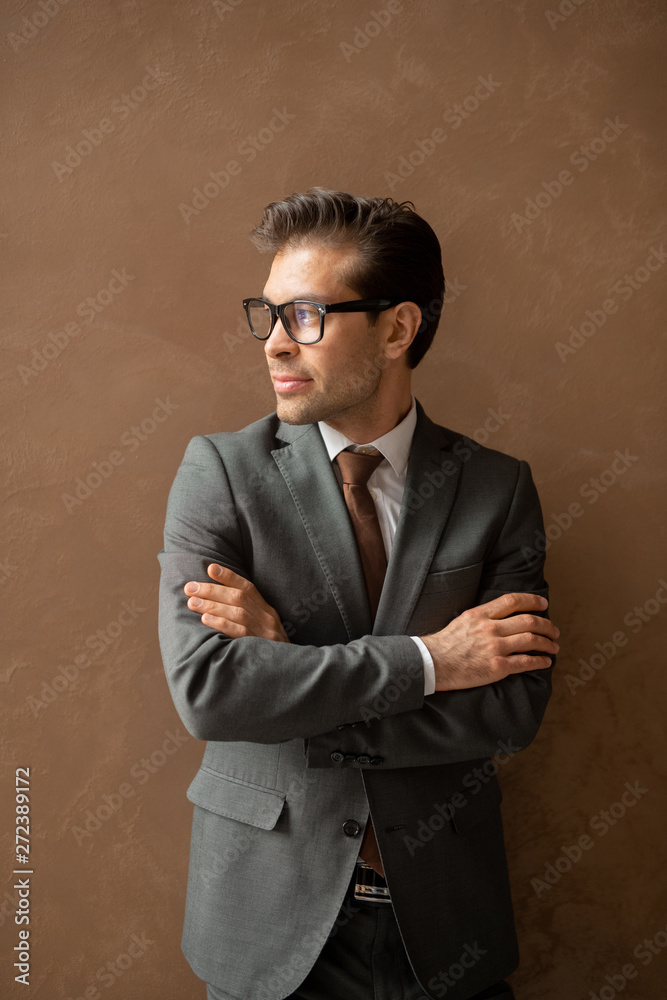 Businessman by wall Businessman by wall