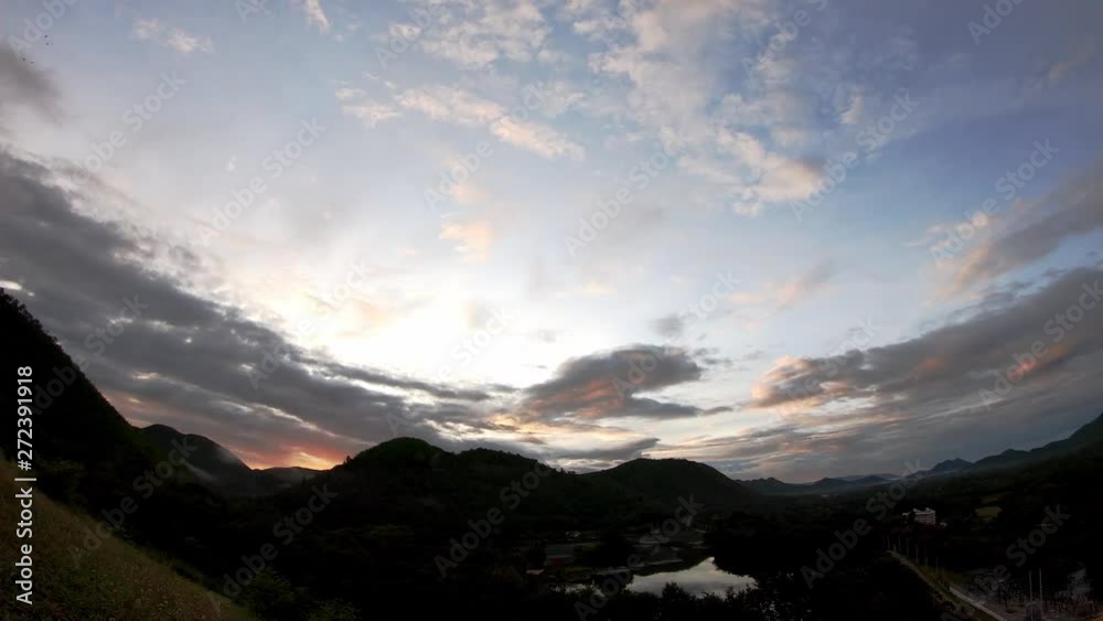 The reflection of the Sun and the clouds move fast on the sky Background mountain and pond at Kaeng Krachan dam in phetchaburi , Thailand. The reflection of the Sun and the clouds move fast on the sky Background mountain and pond at Kaeng Krachan dam in phetchaburi , Thailand.
