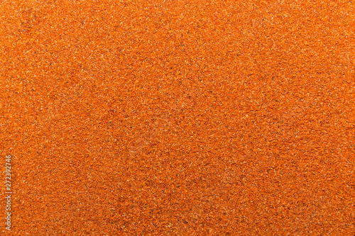 Photo of closeup texture of hot spice of red pepper for different food, background