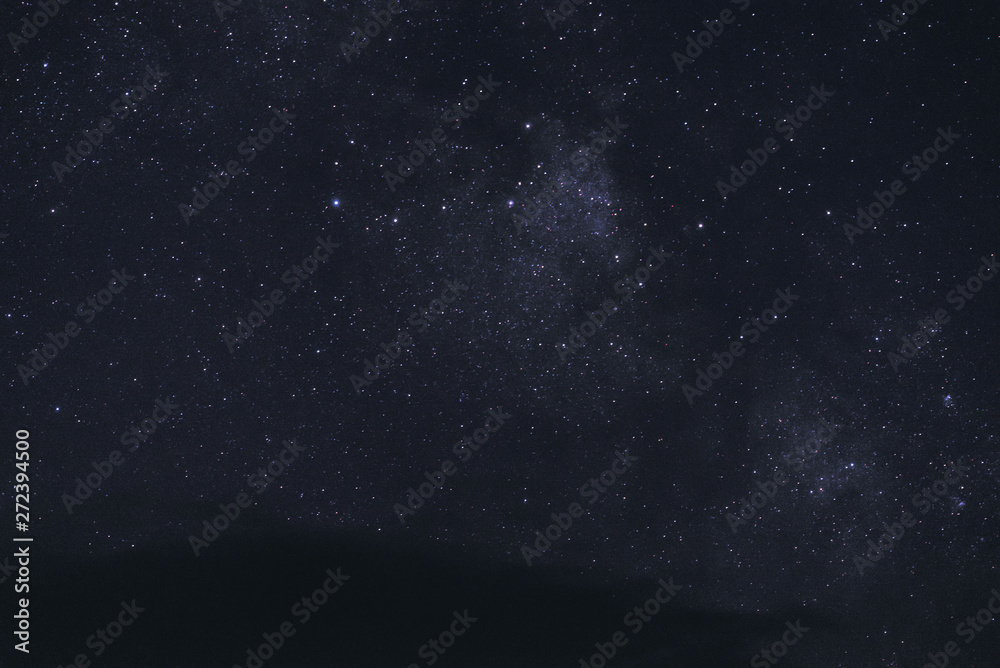 Fototapeta premium Starry sky with clouds at night