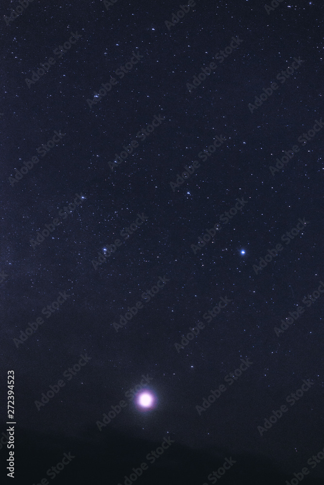 Starry sky with clouds at night