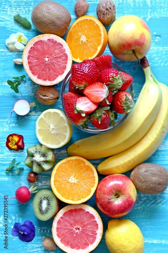 Fruitss on blue background. Top view with copy space. Healthy food concept. photo