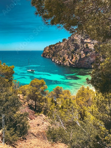Idyllic lovely summer view of the coastline of Mallorca with blue water and sky. 