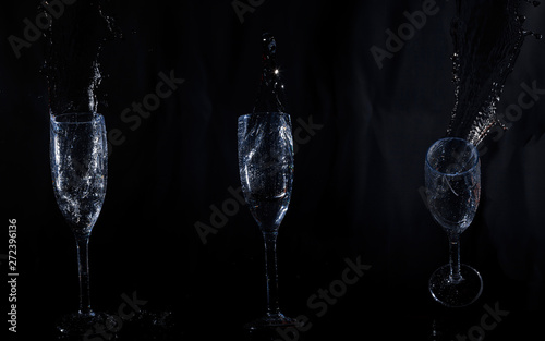 Three crystal glasses with water