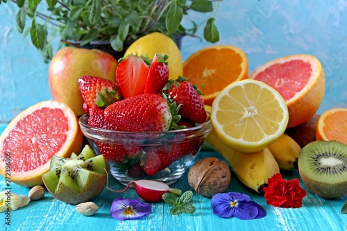 Fruitss on blue background. Top view with copy space. Healthy food concept. photo