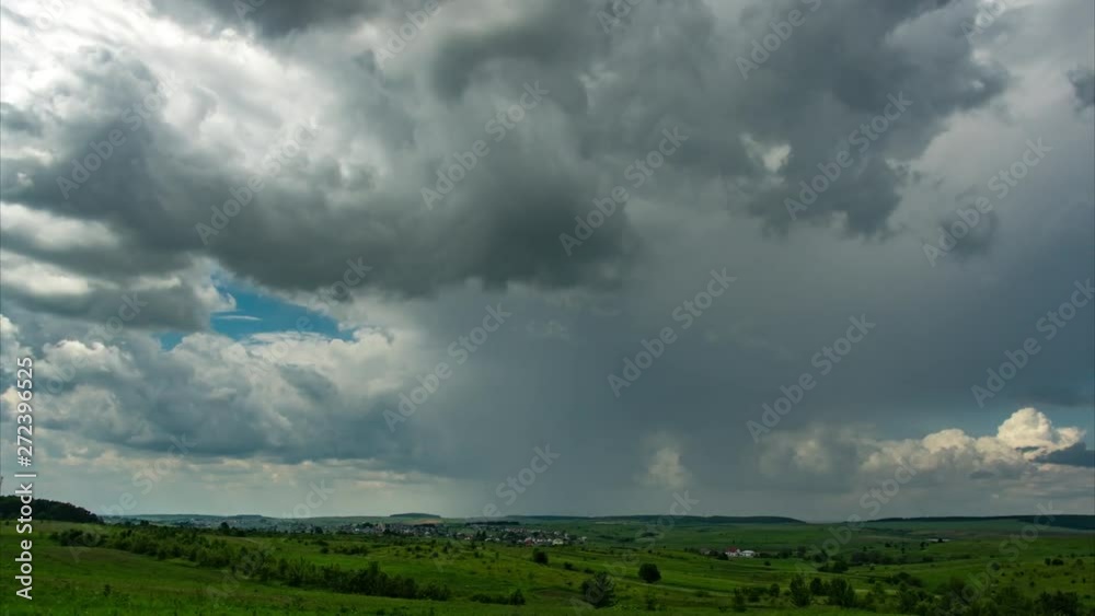 Summer thunderstorm over the village and the field, time lapse Summer thunderstorm over the village and the field, time lapse