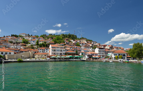 Ochrid, Macedonia: toursit walking and enjoing in the view of old part of Ochrid city on a boat dock on a Ochrid lake