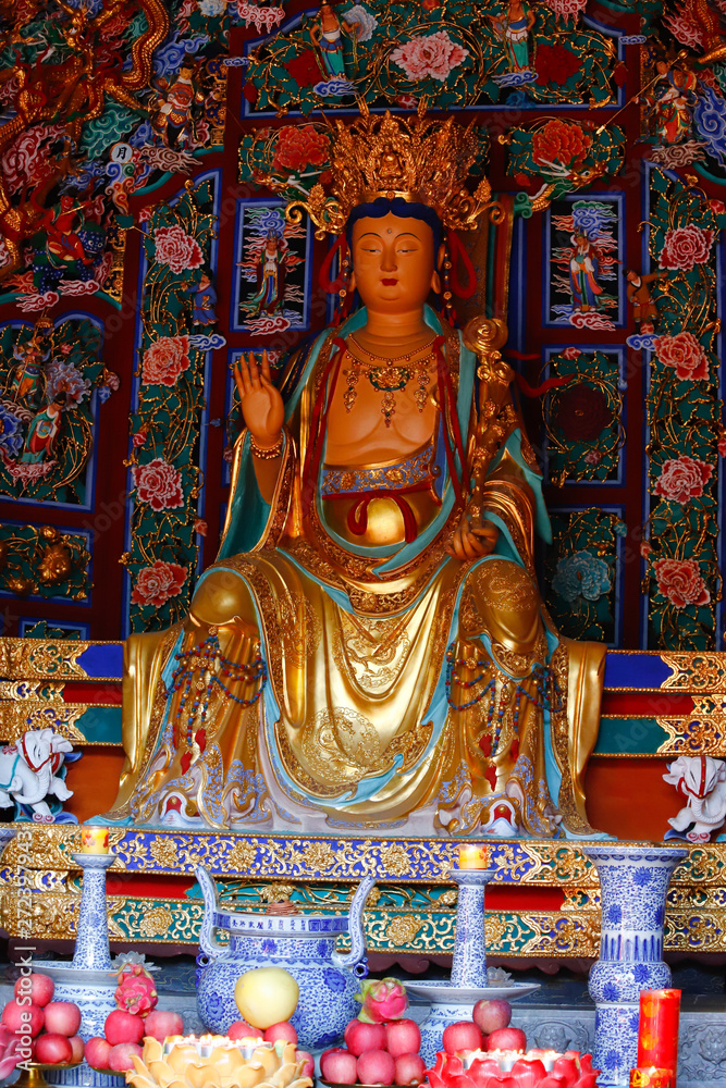 A statue in the Yantong Temple, a large Buddhist complex in Kunming. Yunnan, China - November, 2018