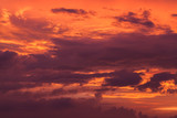 Red cloudy tropical sky at sunset