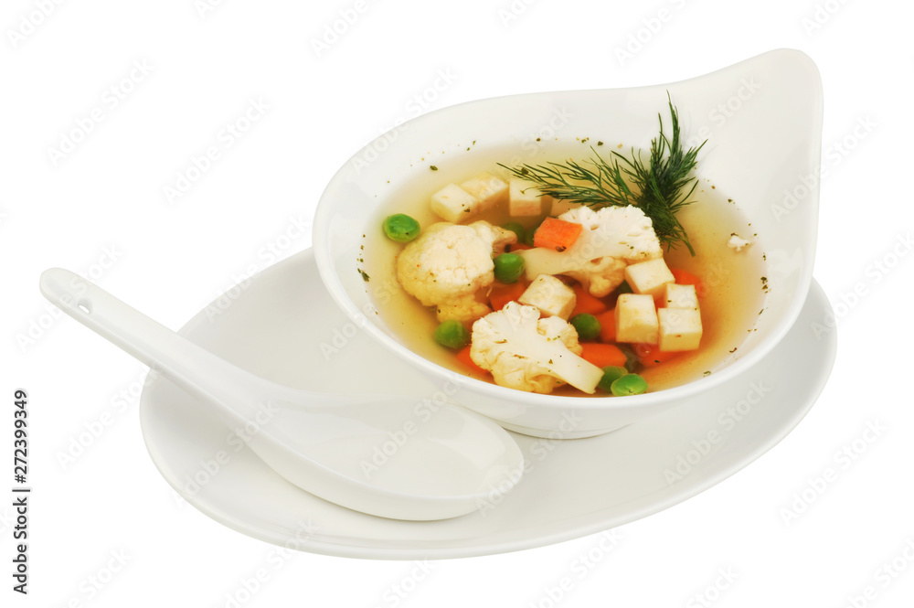 Vegetable soup with cauliflower, potatoes, peas, carrots and dill on a white isolated background Vegetable soup with cauliflower, potatoes, peas, carrots and dill on a white isolated background
