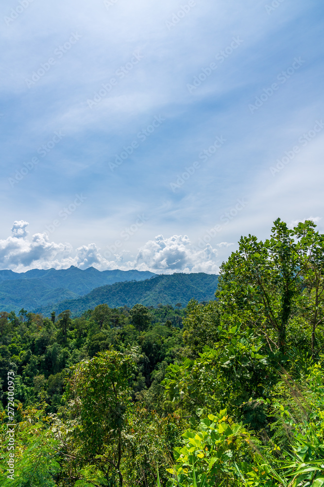 Blue sky high peak mountains fog hills mist scenery national park views at Phu Tub Berk, Khao Koh, Phetchabun Province, Thailand