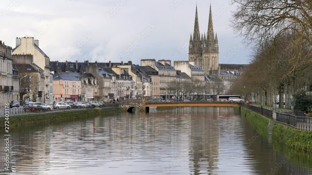 Quimper is a commune and capital of the Finistère department of Brittany in northwestern France. View on the river and on the cathedral. Reflections on water. Quimper is a commune and capital of the Finistère department of Brittany in northwestern France. View on the river and on the cathedral. Reflections on water.