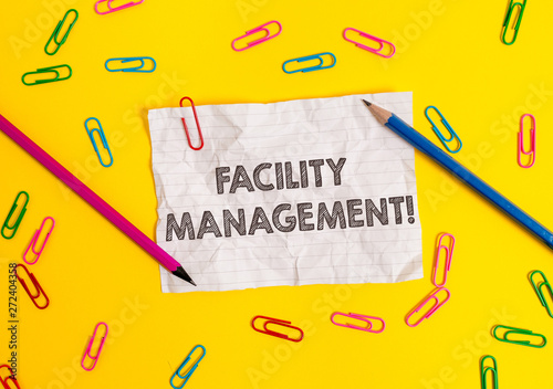 Conceptual hand writing showing Facility Management. Concept meaning Multiple Function Discipline Environmental Maintenance Blank crushed paper sheet message pencils colored background photo