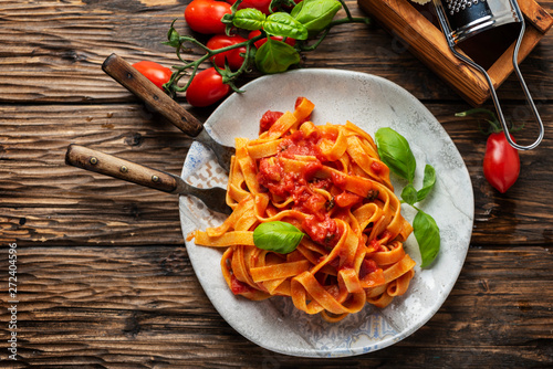 pasta fettuccine with tomato and basil photo
