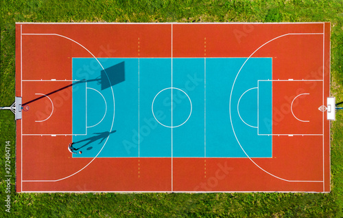 Man Play Basketball on Outdoor Court, Creative Aerial Drone Image