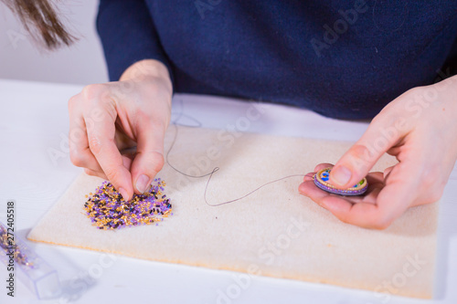 Designer making handmade brooch