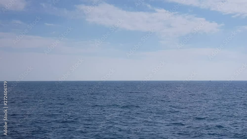 Blue sky with clouds in sunny weather over the ocean.View of the ocean and clouds in the sky.