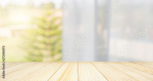 Empty wood table top with window curtain abstract blur background for product display
