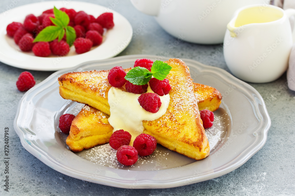 French toast with english sauce and raspberries. French toast with english sauce and raspberries.