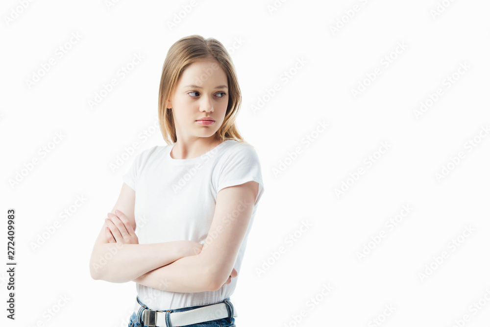 Fototapeta premium offended teenage girl with crossed arms looking away isolated on white