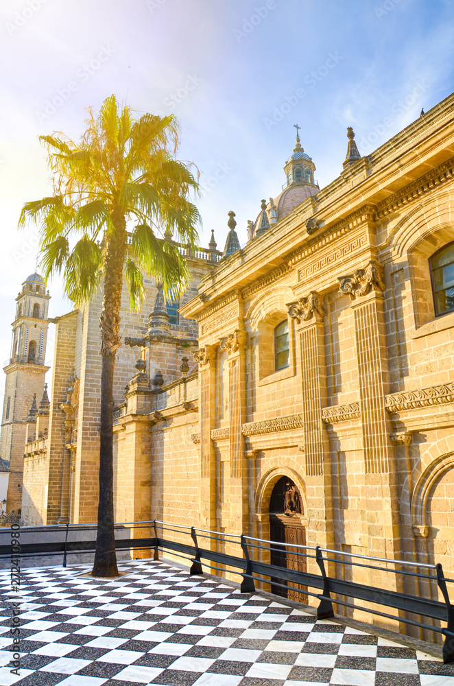 Amazing cathedral in Jerez de la Frontera in Andalusia, Spain photographed with single palm tree in a sunset light. Popular tourist spot. Summer vibes, summer vacation concept Amazing cathedral in Jerez de la Frontera in Andalusia, Spain photographed with single palm tree in a sunset light. Popular tourist spot. Summer vibes, summer vacation concept