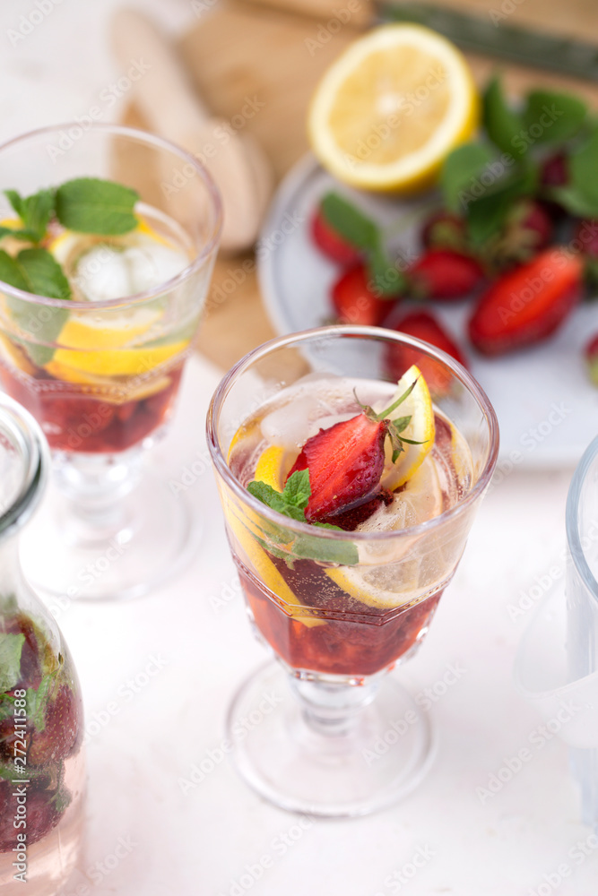 olorful refreshing drinks for summer, cold strawberry lemonade juice in the glasses with ice cubes. olorful refreshing drinks for summer, cold strawberry lemonade juice in the glasses with ice cubes.