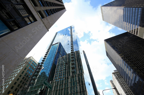 Looking up at dramatic skyscrapers at the corner of North Michigan Ave and East Lake St in downtown Chicago, Illinois, USA. photo