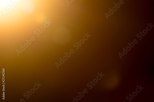 Canvas Print Lens flare and light beam on dark background yellow color, photo from lens camer