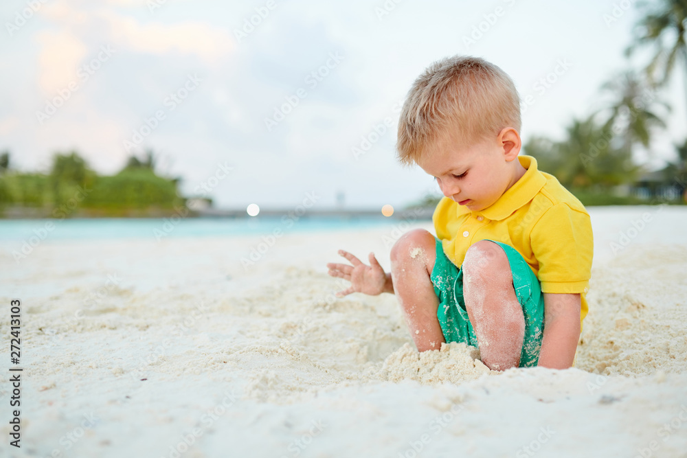 Three year old toddler boy on beach. Summer family vacation at Maldives. Three year old toddler boy on beach. Summer family vacation at Maldives.