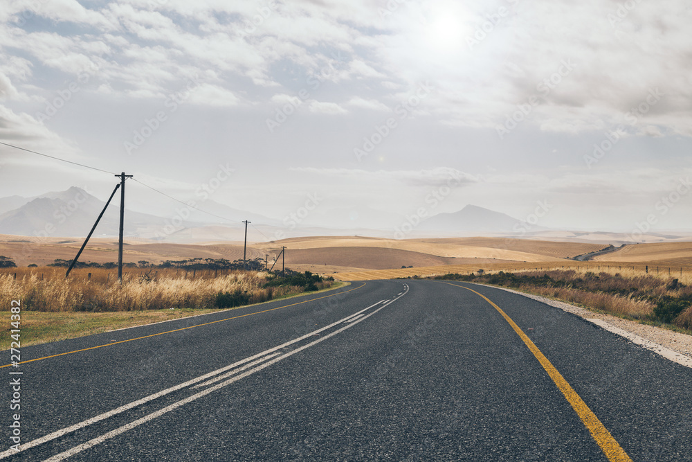 Fototapeta premium Curvy countryside road in South Africa in spring season