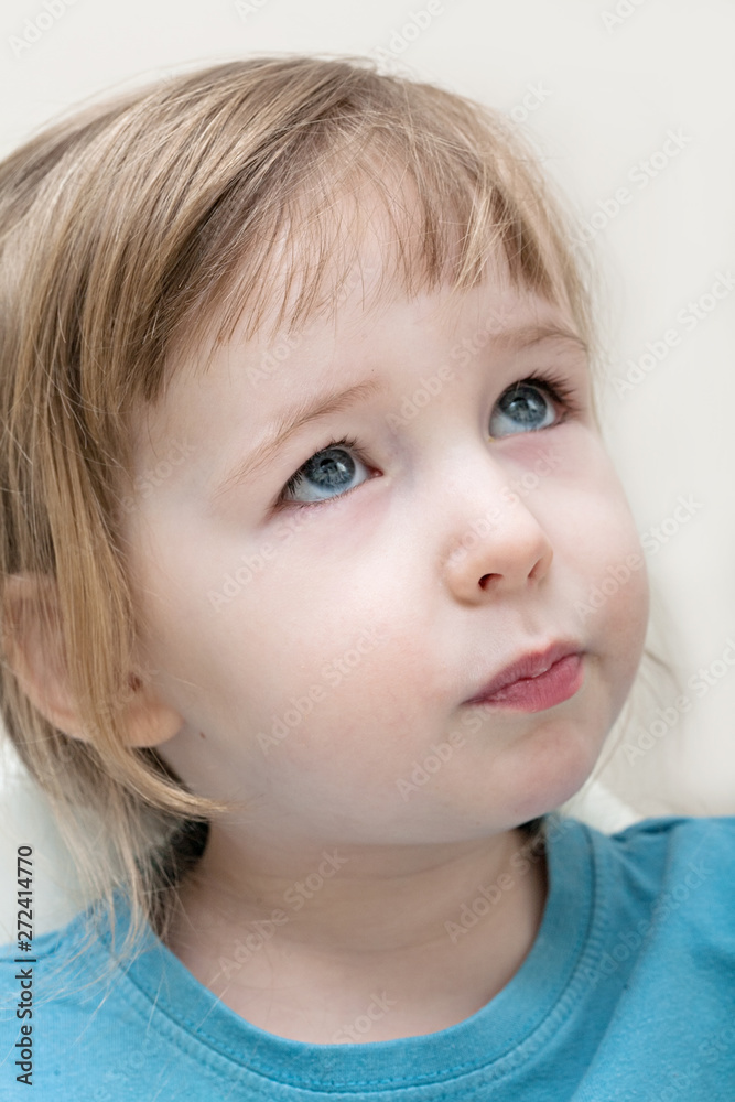 funny serious emotional white child girl face closeup funny serious emotional white child girl face closeup