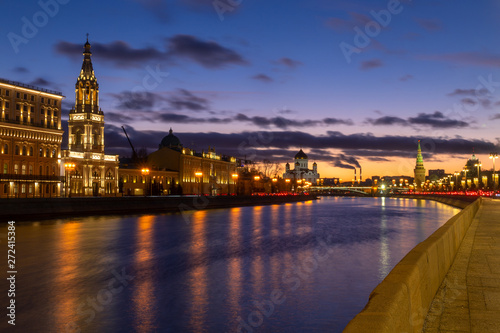 Beautiful sunset on Moskva river embankment with a view of Kremlin wall and Cathedral of Christ the Saviour in Moscow, Russia