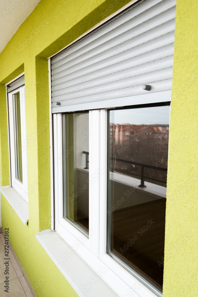 Window in yellow modern house Window in yellow modern house