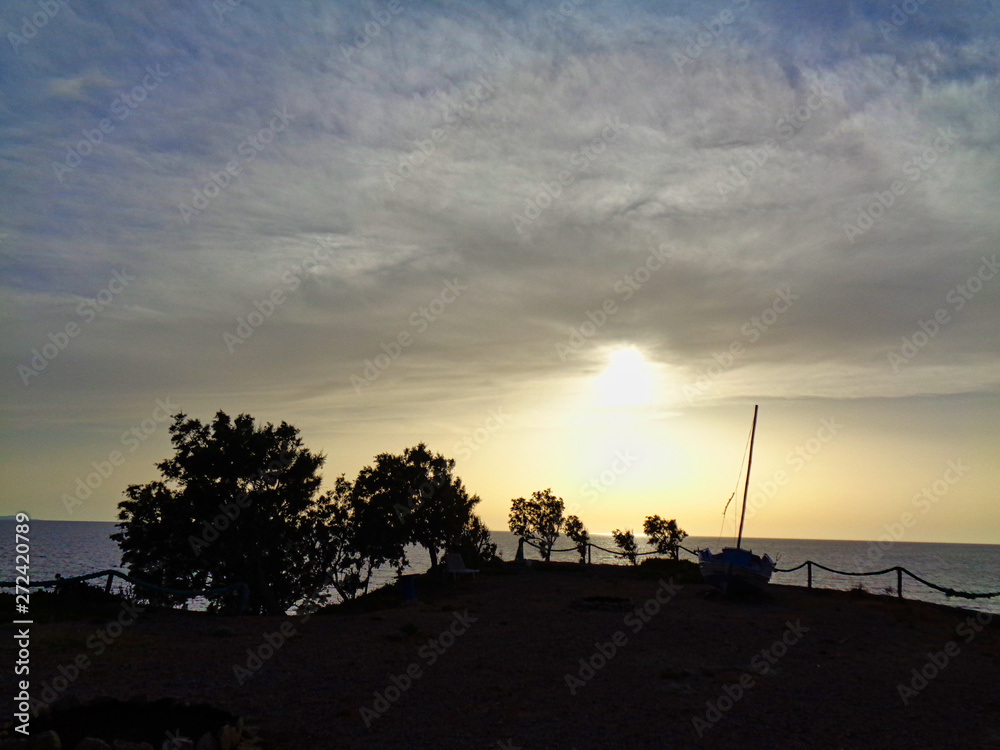 Obraz premium sunset over the bay in greece