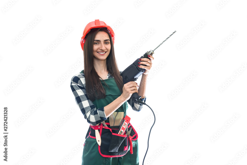 Beautiful woman in coverall holding drill machine isolated on white Beautiful woman in coverall holding drill machine isolated on white