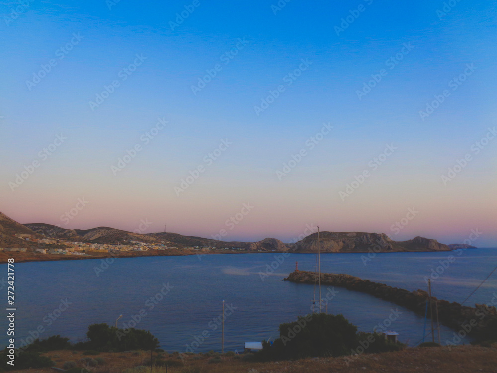 sunset at the bay in greece at summer