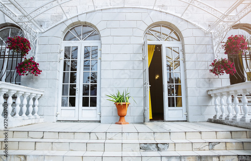 The part of house in Italian style. Doors, stairs and plants. Exterior ideas.