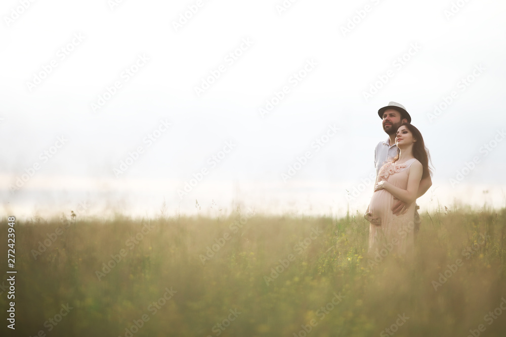 Couple man and pregnant girl in the field Couple man and pregnant girl in the field