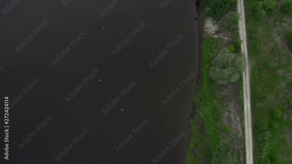 Aerial river view flying above Daugava - Beautiful nature water landscape scenery in the evening - Drone top view cinematic professional smooth motion Aerial river view flying above Daugava - Beautiful nature water landscape scenery in the evening - Drone top view cinematic professional smooth motion