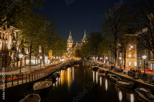 Canalhouses with a glimp of the Rijksmuseum in the Netherlands 
