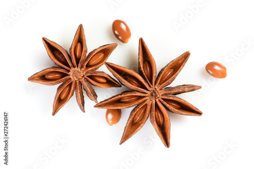 Star anise. Two star anise fruits with three seeds. Macro close up Isolated on white background with shadow, top view of chinese badiane spice or Illicium verum.