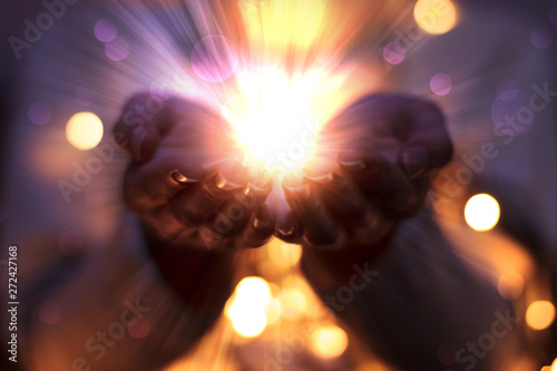 magic particles on the palms of a woman, the flow of magical energy emanating from female hands Fototapet
